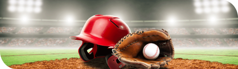 A red baseball helmet, a brown leather glove, and a baseball are placed on a pitcher's mound in an empty stadium under bright lights. With the blurred stands behind, this scene captures the spirit of St. Louis' vibrant passion for the game.