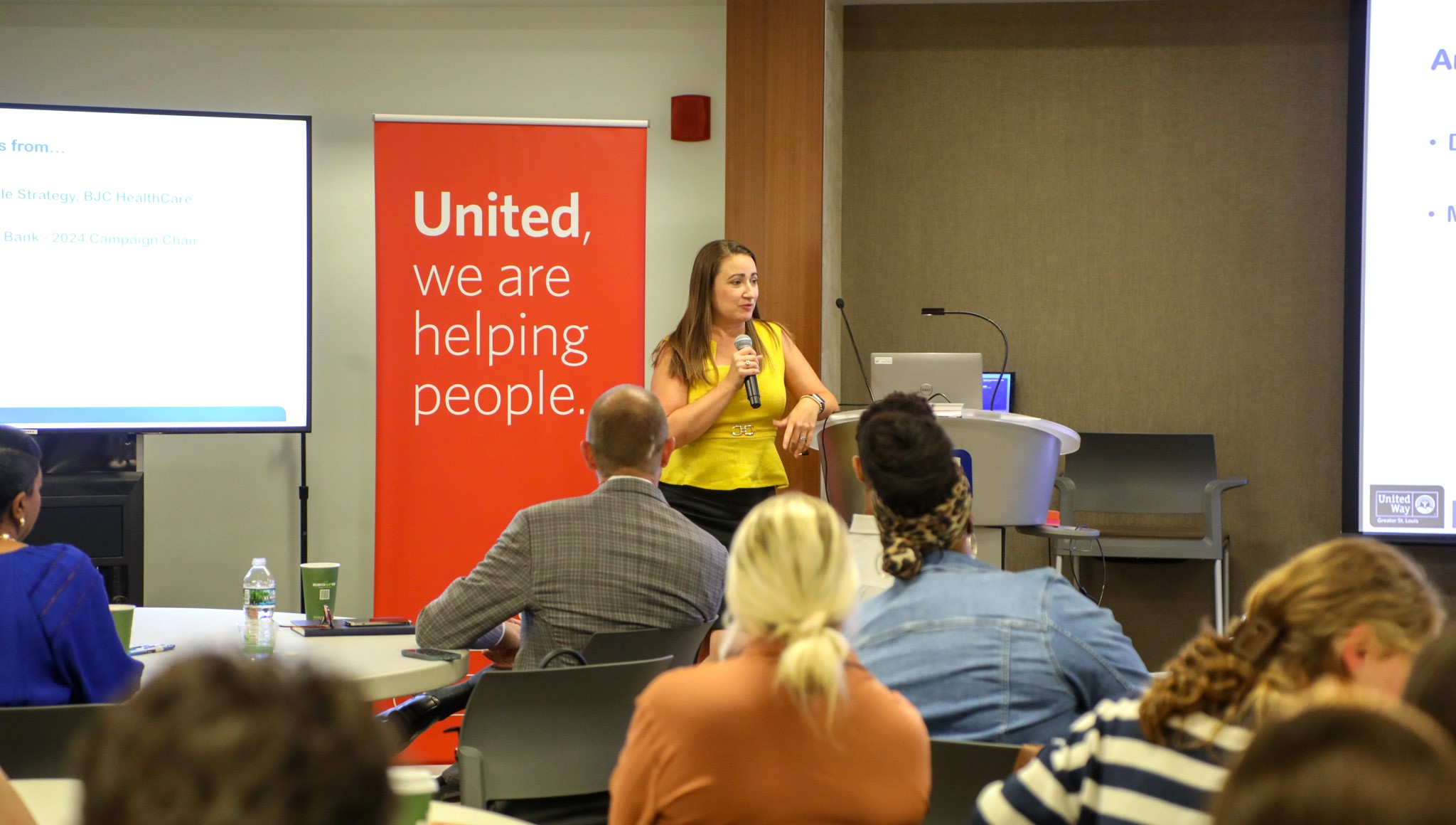 United Way Campaign Vice-Chair, SiSi Beltran, speaks in front of a group