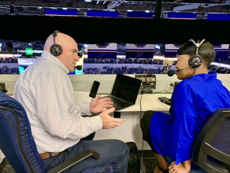 Michelle Tucker in the announcer booth at the Blues Game