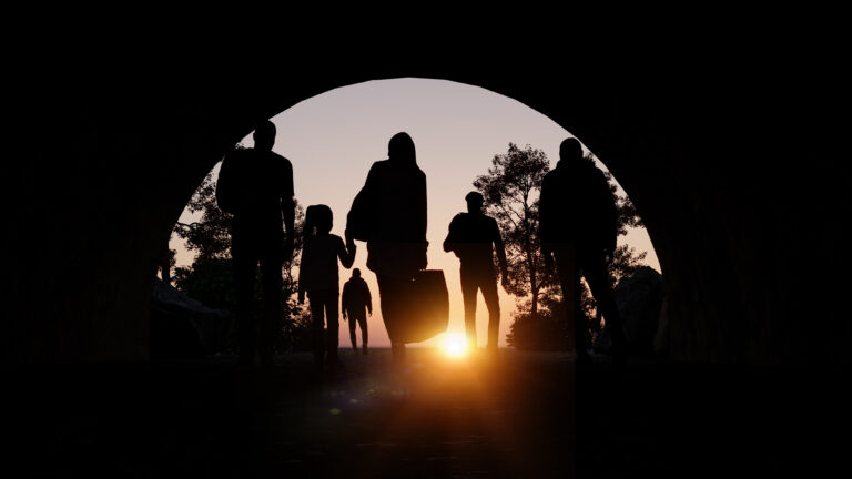 Column of migrants passing through a tunnel.