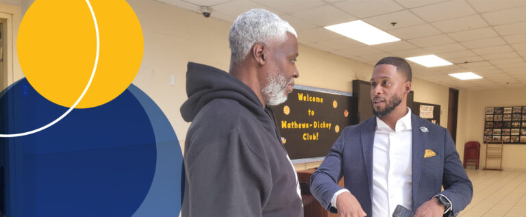 Photo of Brandon Williams talking in a hallway