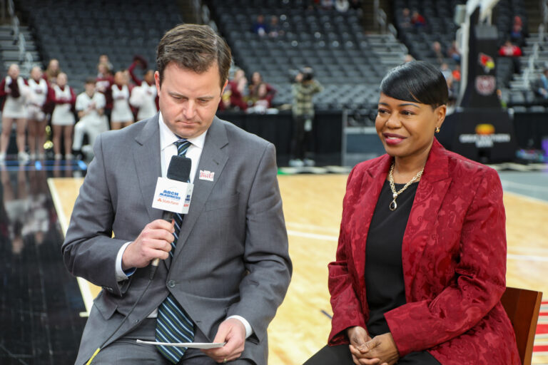 Michelle Tucker interviewed courtside during basketball game